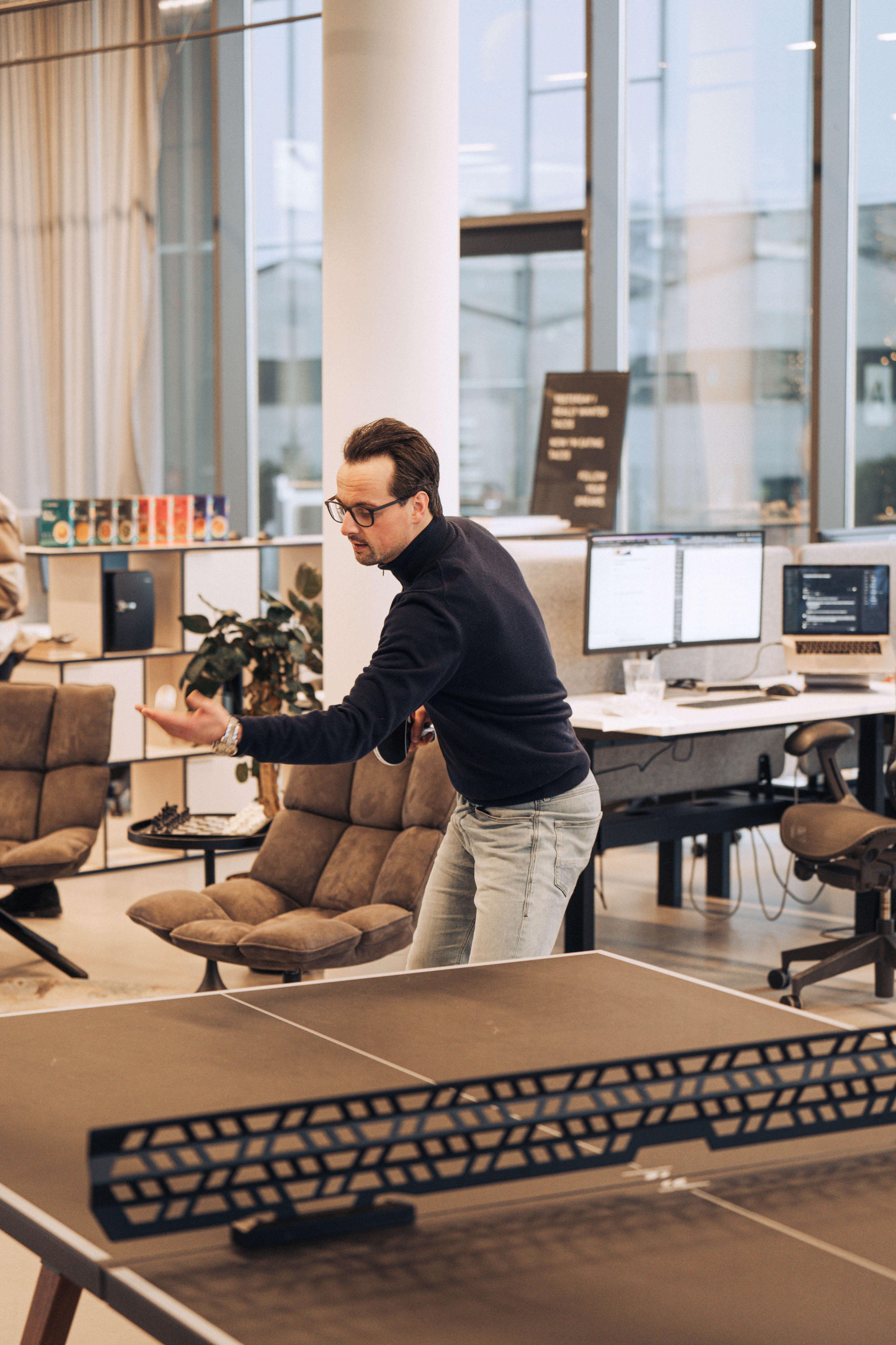 Employee playing table tennis 2